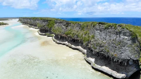 Aerial footage: Cliffs of Lekiny in the same lagoon as Mouli bridge. Ouvea. Stock Footage 126611810