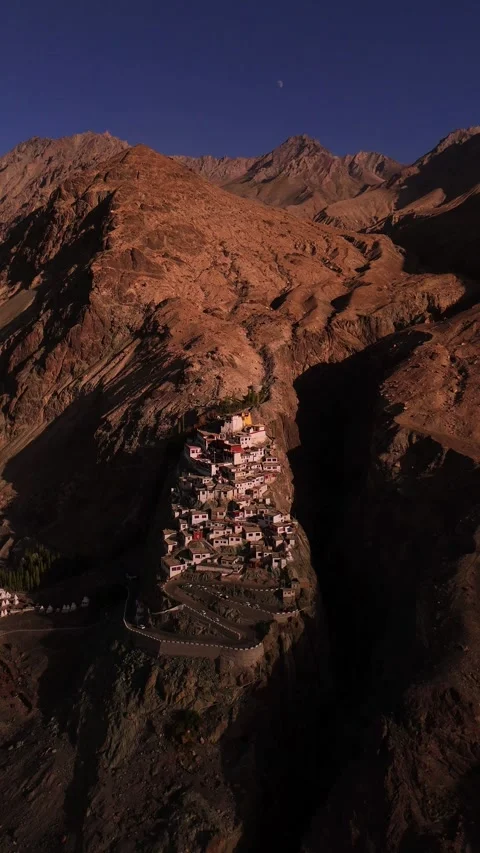 Aerial footage of Diskit Monastery glowing under the golden ladakhi Landscape. Stock Footage 310900939