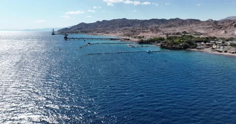 Aerial footage of the dolphin reef in Eilat on the Red Sea Video stock 237458355