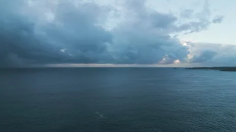 Aerial footage of dramatic rainy clouds over the sea in Izu peninsula, Shizuoka Stock Footage 249639495