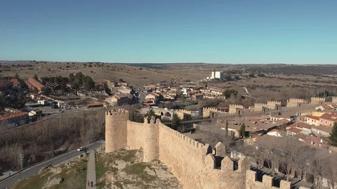 Aerial footage by a drone ascending above a corner of the Wall of Avila Video stock 122940341