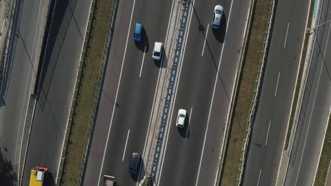 Aerial footage from drone, top down view, cars running on the freeway, heavy Stock Footage 114802406
