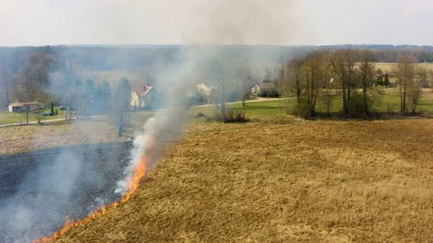 Aerial footage of fire on the fields, burning grass Stock Footage 106107155