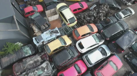 Aerial footage flying above car wrecks on scrapyard Stock Footage