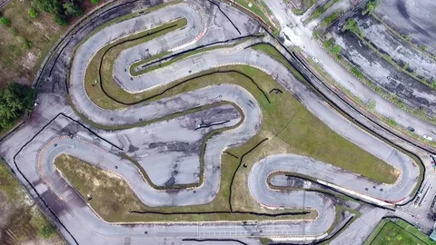 Aerial footage of go kart track with racing going on Stock Footage