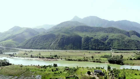 Aerial footage, the interaction between the river and the mountains Stock Footage 260273688