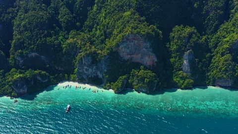 Aerial footage of Koh Phi Phi Don Western Ton Sai bay cliffs overlooking crys Stock Footage 124273164