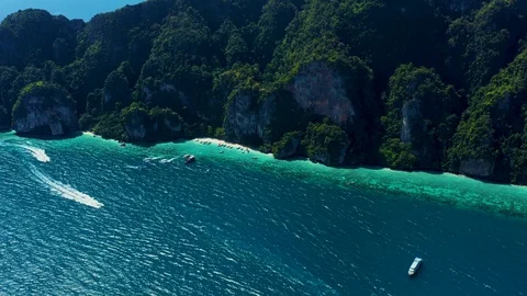 Aerial footage of Koh Phi Phi Don Western Ton Sai bay cliffs overlooking crys Stock Footage 124273178