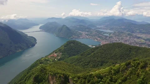 Aerial footage of Lake Lugano and mountain in Switzerland Stock Footage