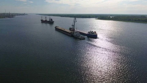 Aerial footage of large container ship on the river Stock Footage 83544201