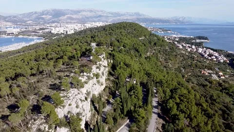 Aerial footage Marjan Hill facing mountain range an sea, 2.7K Stock Footage