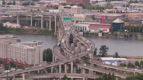 Aerial footage of a massive bridge with an intersection and lots of traffic, USA Stock Footage 155791075