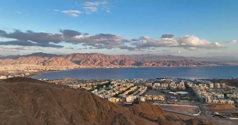 Aerial footage of the mountains of Eilat, In the background eilat city Stock Footage 237494605
