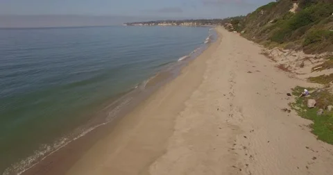 Aerial footage over an empty beach Malibu, California Stock Footage 68514084