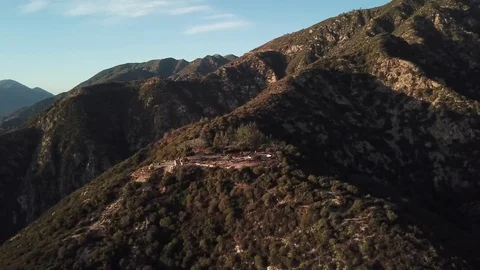 Aerial Footage Pull Back From People Walking on California Mountain Top Stock Footage 84620955