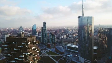 Aerial footage shooting with drone on Milan skyline at sunset Stock Footage