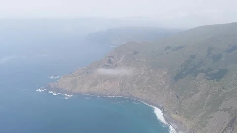 Aerial footage showcasing the dramatic cliffs and rugged coastline around Garita Stock Footage 346706376