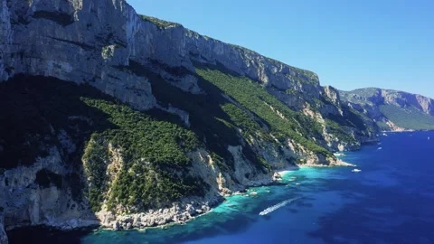 Aerial footage showcasing the dramatic limestone cliffs and vibrant turquoise Stock Footage 346665219