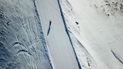 Aerial footage of skier craving on ski slope in Livigno, Italy Stock Footage