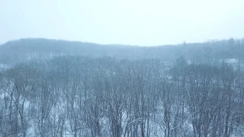 Aerial Footage of a snowy hill side in Wisconsin Stock Footage