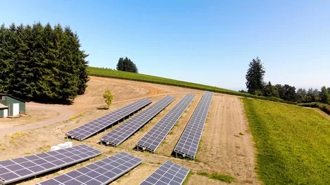 Aerial footage of a solar panel array in rural Oregon overlooking a valley. Stock Footage 115312504