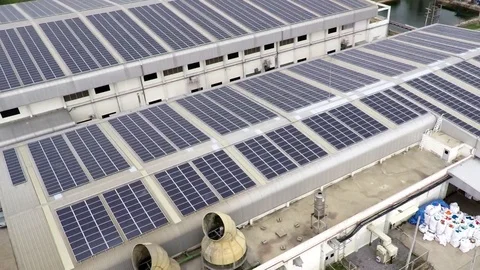 Aerial footage of solar panels on rooftop Stock Footage