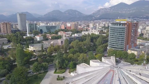 Aerial footage of Tirana city center close to the pyramide and catholic church Stock Footage