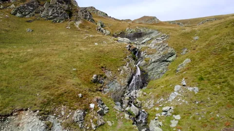 An aerial Footage of trees and mountains on the Transalpina road Stock Footage 218250341