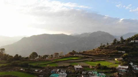 Aerial footage of village in the middle of mountains Stock Footage