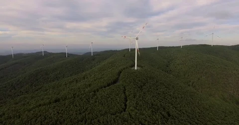 Aerial footage, wind turbines in the green forest, 4k Stock Footage