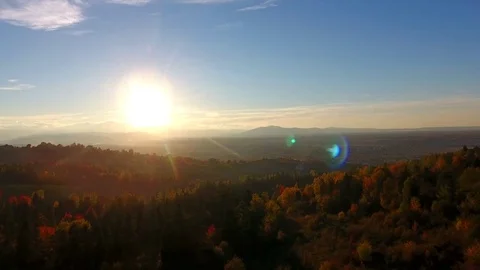 Aerial forest sunset - light touching treetops. Mountains sund dusk. Stock Footage 83127893