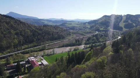 Aerial Forest view with river and mountains in distance, Orava, SK Stock Footage 311732954