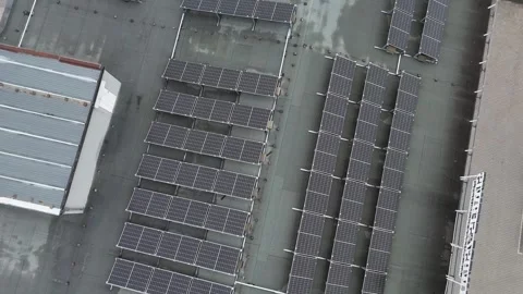 Aerial Forward Arcing Flight Over Solar Panels on Roof Stock Footage 323965651
