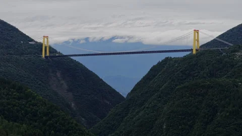 Aerial Forward Ascend Mountain Suspension Bridge 4K HLG Stock Footage 345620698