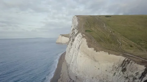 Aerial Forward Ascending: Cliff Facing the Vast Sea-Dorset, England Stock Footage 149113604