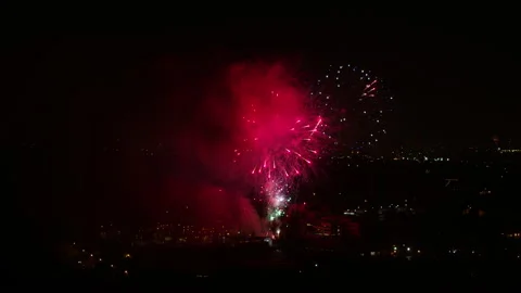 Aerial Forward Beautiful Sparks Of Exploding Fireworks In Dark City - Los Stock Footage 169490268