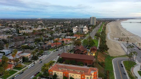 Aerial Forward of City By Ocean Shore With Blue Sky - Long Beach, California Stock Footage