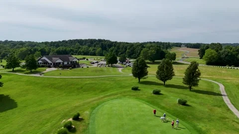 Aerial Forward Drone Push Over Golf Green Towards Distant Parking Lot Stock-Footage 337637500