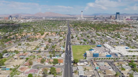 Aerial forward drone shot of Las Vegas homes and Strip downtown city skyline Stock-Footage 333484420