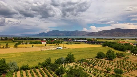 Aerial Forward Drone Shot Over Farms and Agricultural Fields 스톡 동영상 340477431