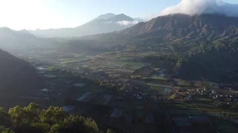Aerial Forward Drone View of Mount Batur and Farmland Landscape in Bali Stock Footage 330778819