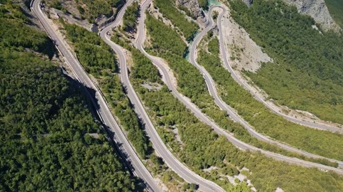 Aerial Forward Flight and Tilt Down of SH20 Winding Road in Albania Stock-Footage 332077208