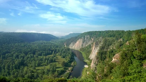 Aerial forward: Flight from a cliff at sunny summer morning Stock Footage 114722053