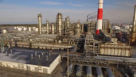 Aerial forward flight Gas refinery large complex production factory contrast Stock Footage