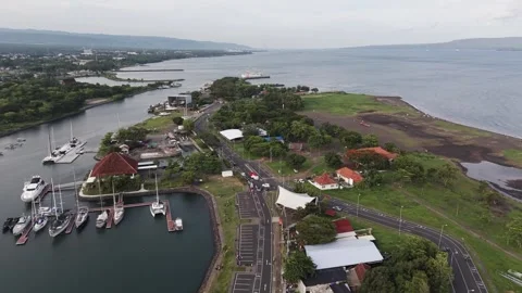 Aerial Forward Flight Over Boom Beach Marina and Coastal Roads in Banyuwangi Stock Footage 336708080