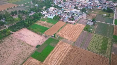 Aerial forward Flight Over Crowded Village and farmland in Punjab Video stock 333069837
