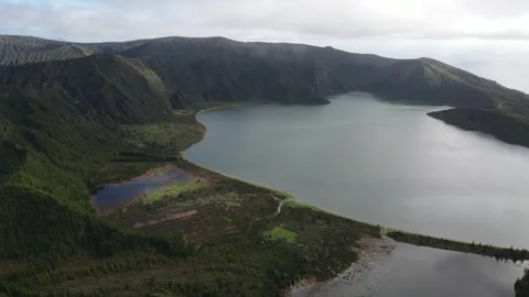 Aerial forward flight over Lagoa do Fogo crater lake, Azores, 4K 30fps. Stock Footage 333365557