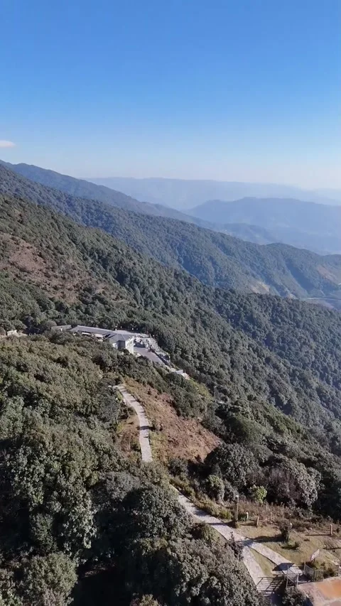 Aerial Forward Flight Over Lush Mountain Forest and Tourist Station Vídeos de archivo 329007227