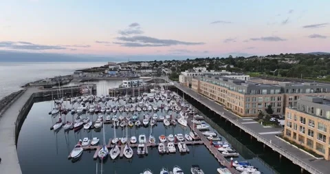 Aerial forward flight over luxury yachts and boats moored in Greystones Harbo Stock Footage 340323039
