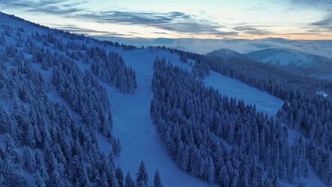 Aerial forward flight over snow heavy slopes of Pilsko mountain Stock Footage 336365559